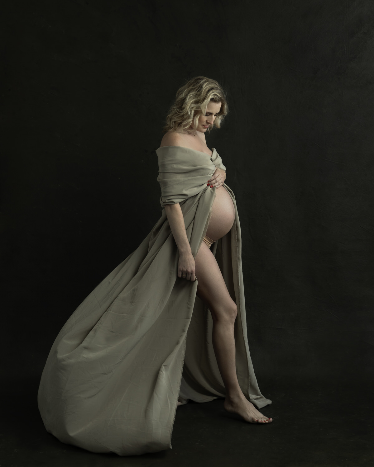 Pregnant woman wearing a flowy dress.