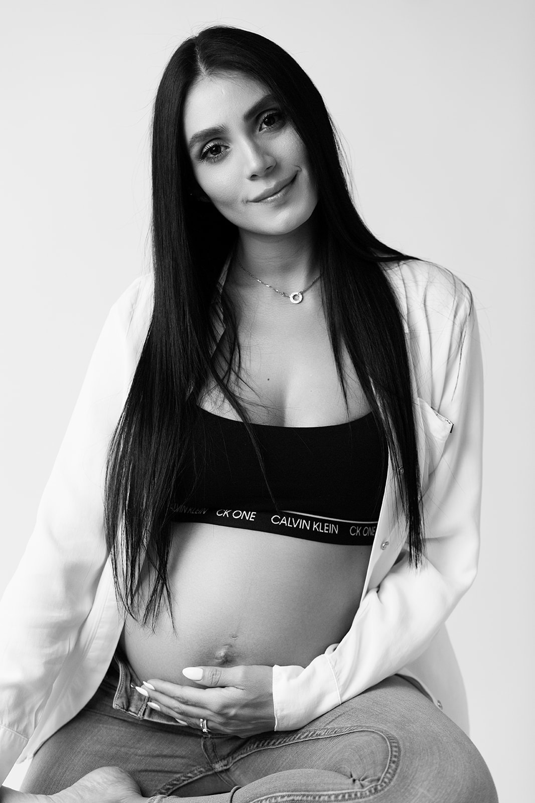 Pregnant woman photographed in black and white in Toronto studio