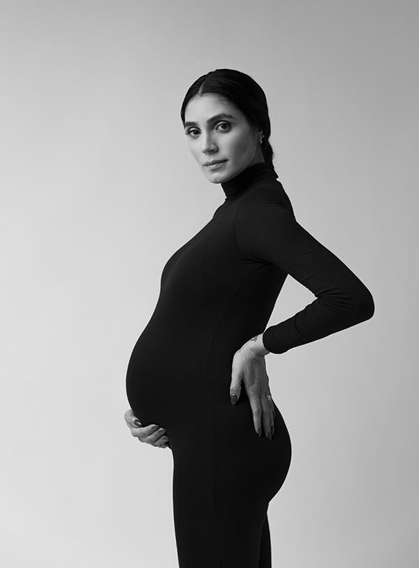 pregnant woman photographed in black and white in toronto studio