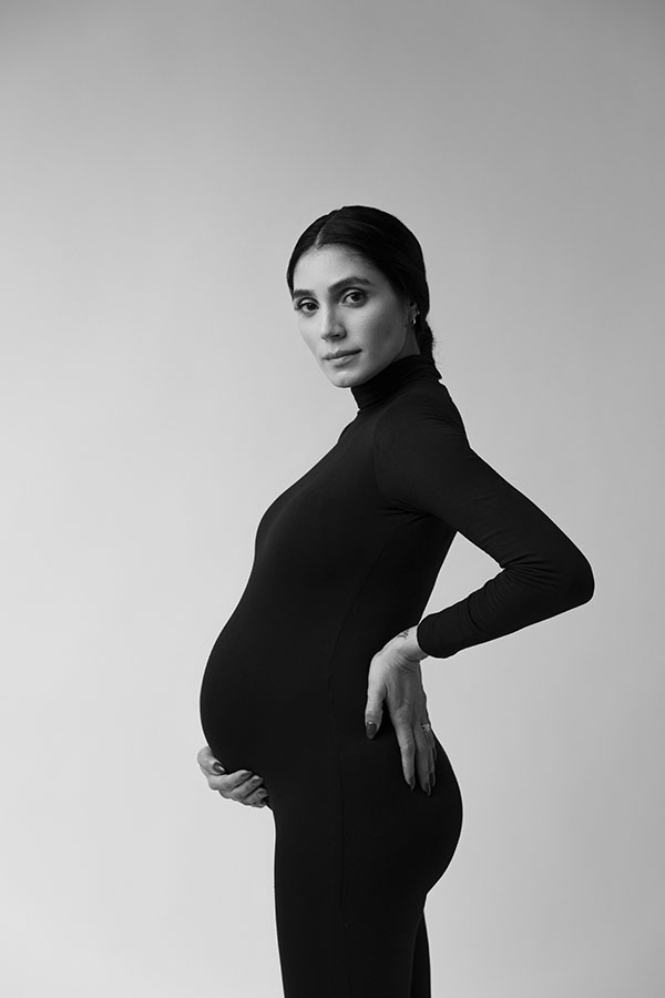 pregnant woman photographed in black and white in toronto studio