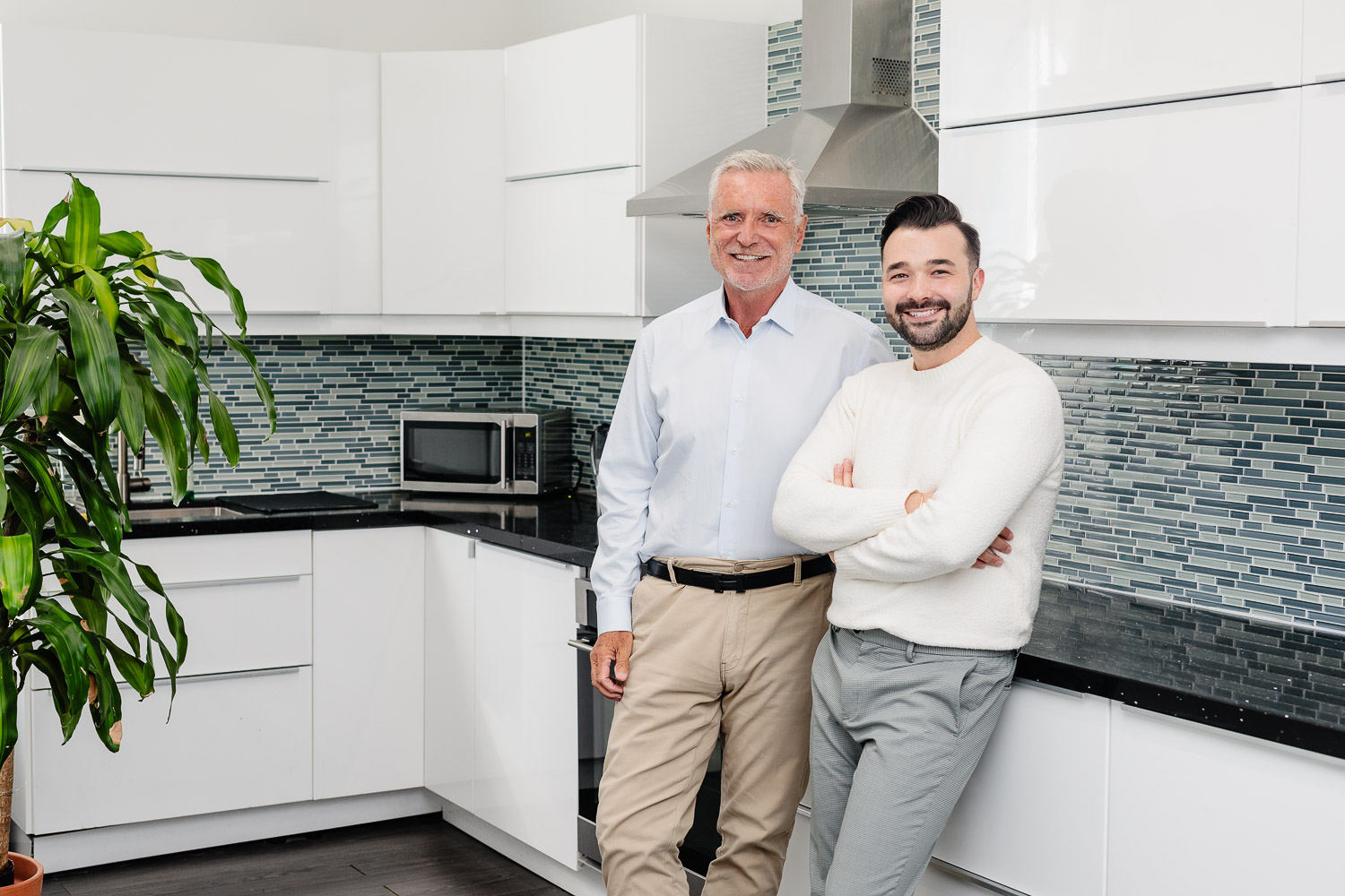 Toronto realtors posing for a photoshoot in a kitchen