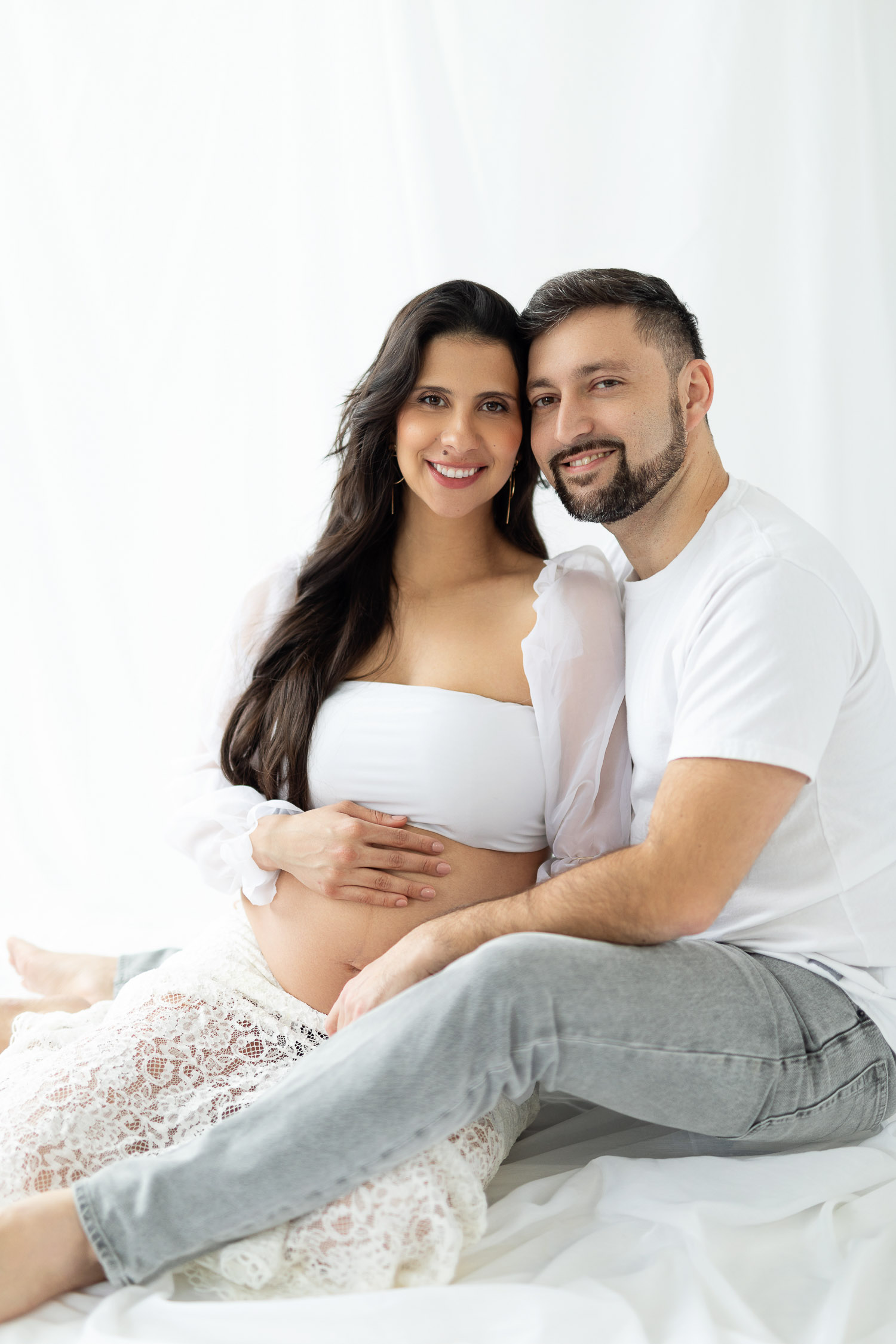 Couple posing for a maternity photoshoot